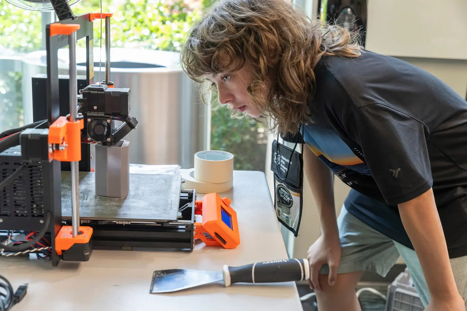 A male student works on a 3D printing research project during the Appalachian STEM Academy