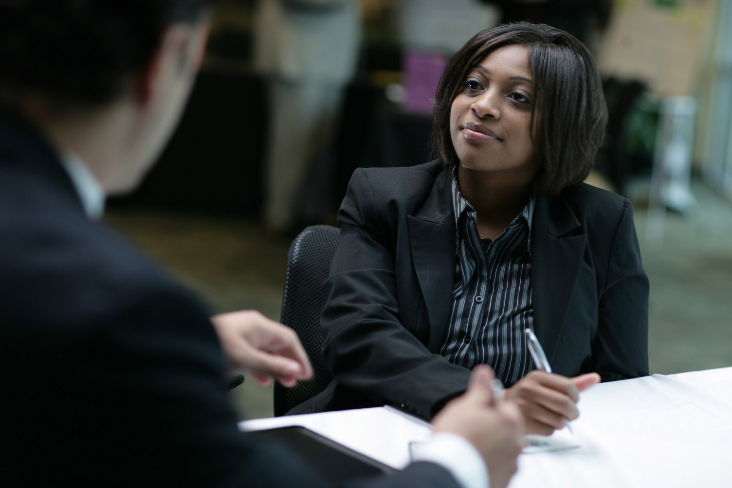 An ORAU employee meets with a customer