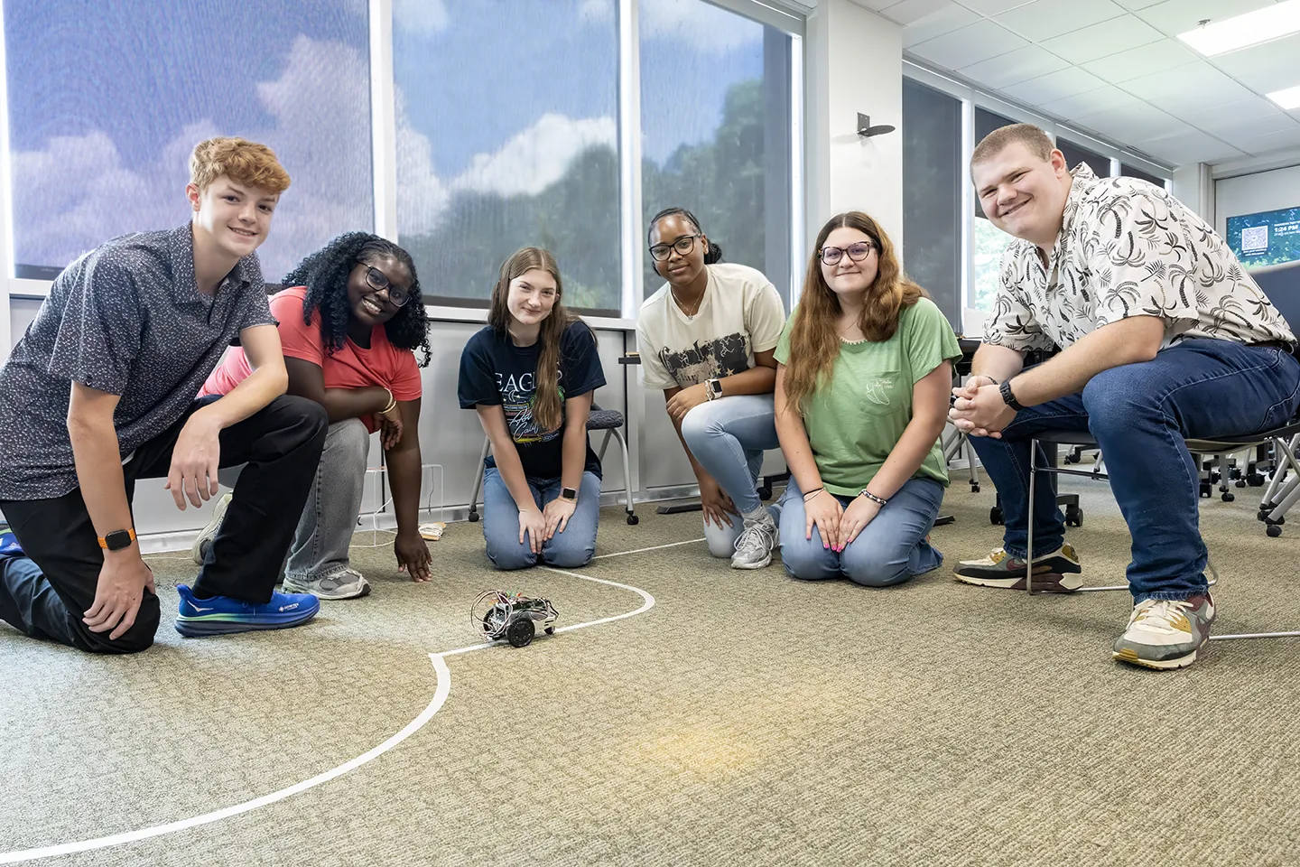 Appalachian STEM Academy high schoolers divided into various research groups like robotics.