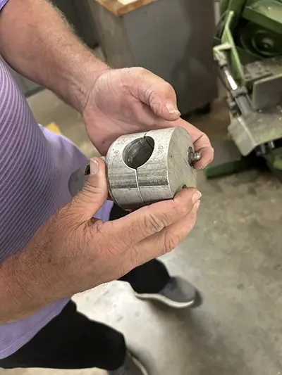 ATDD Research Manager Randy White holds his custom-designed “puck” for ATDD’s weather station towers.