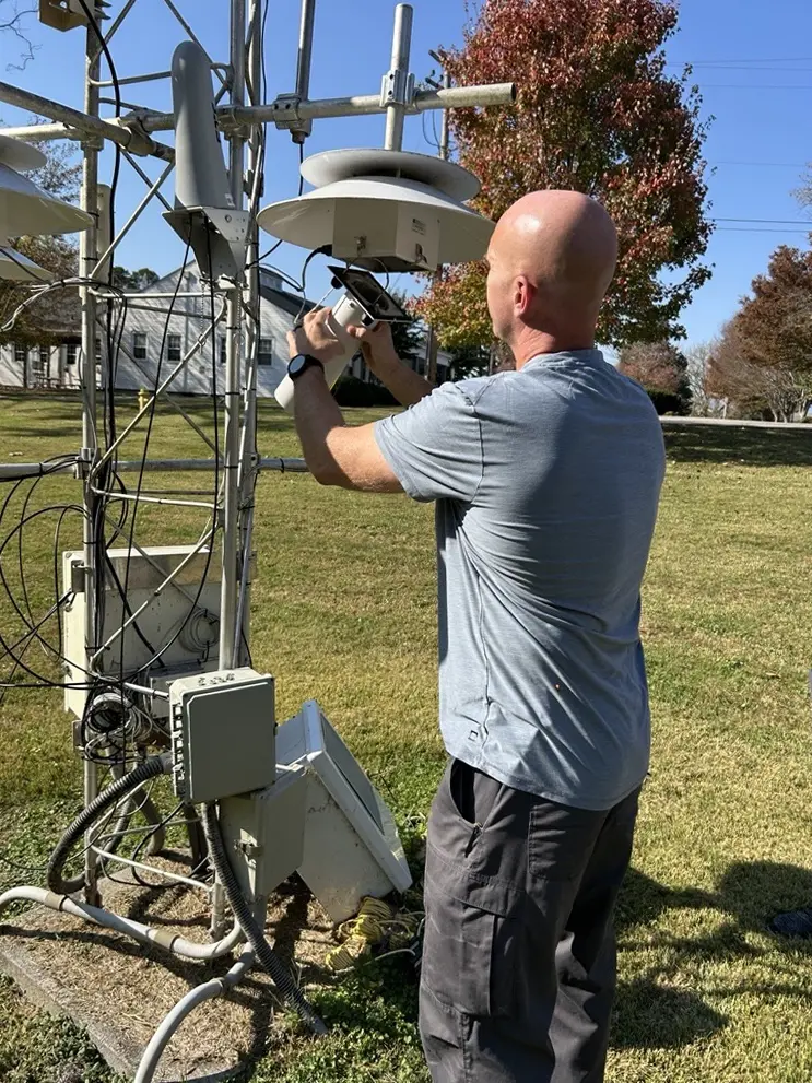 ORAU Manager Mike Rutherford checks one of ATDD’s towers.