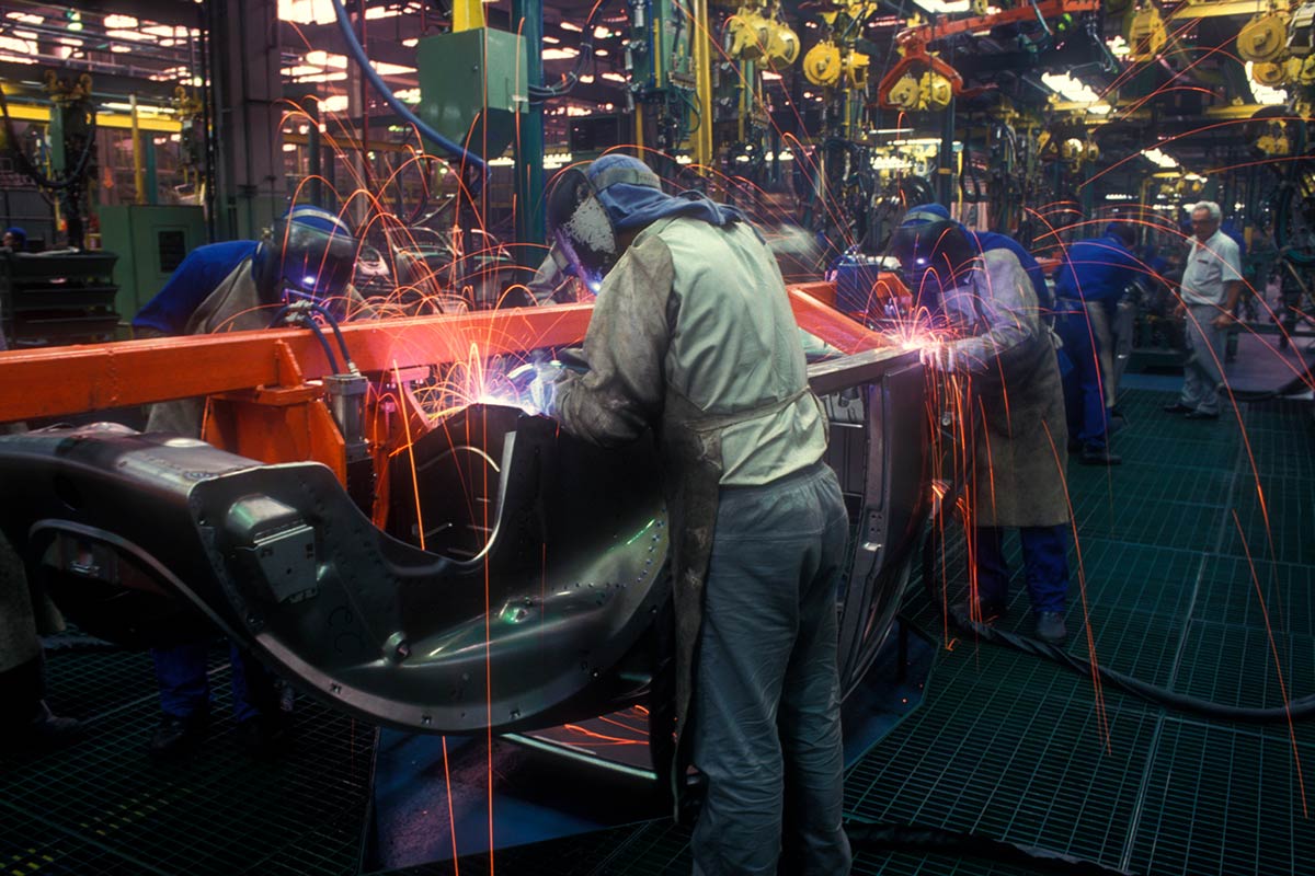 Workers in auto manufacturing plant