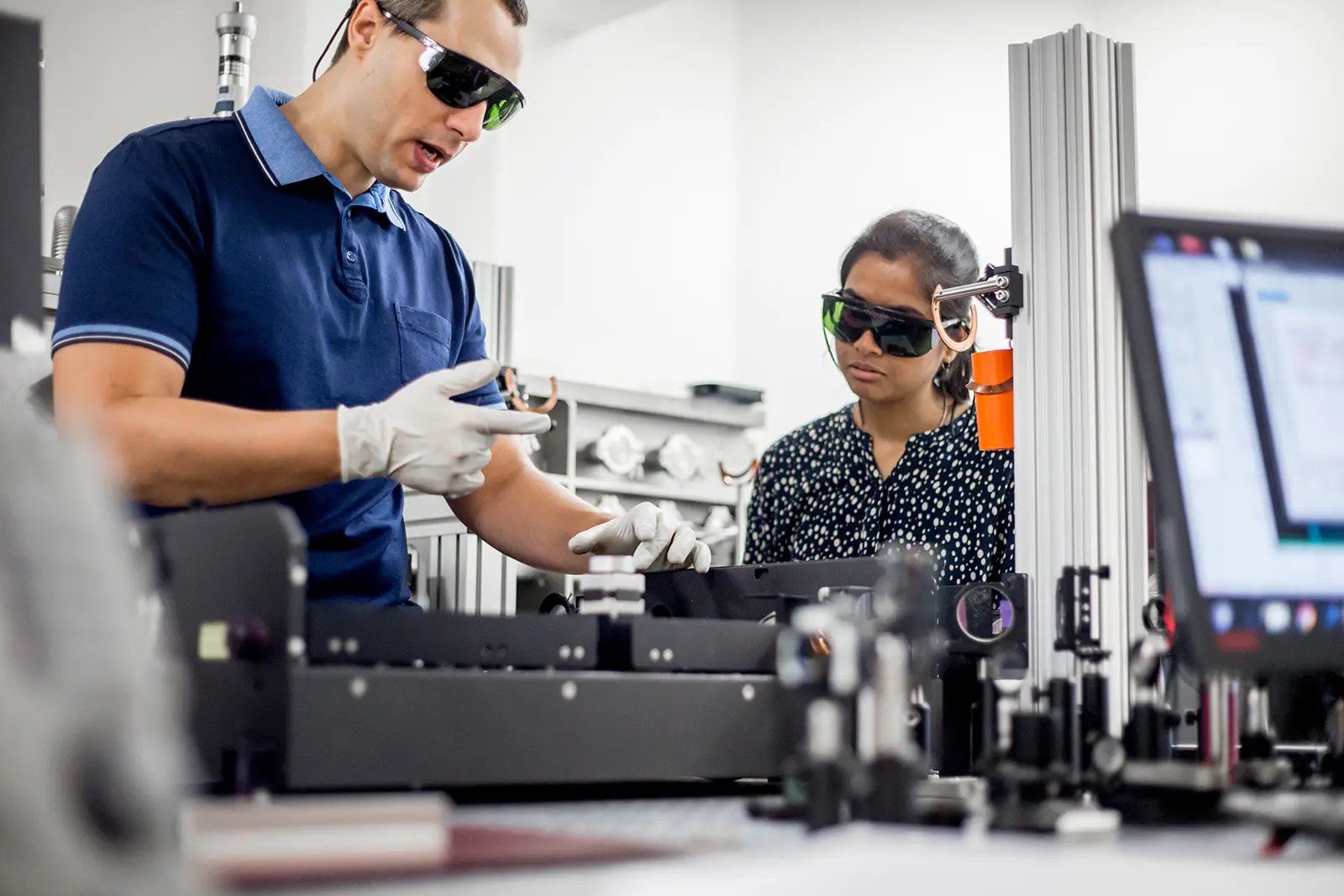 Two scientists conduct research in a laboratory setting