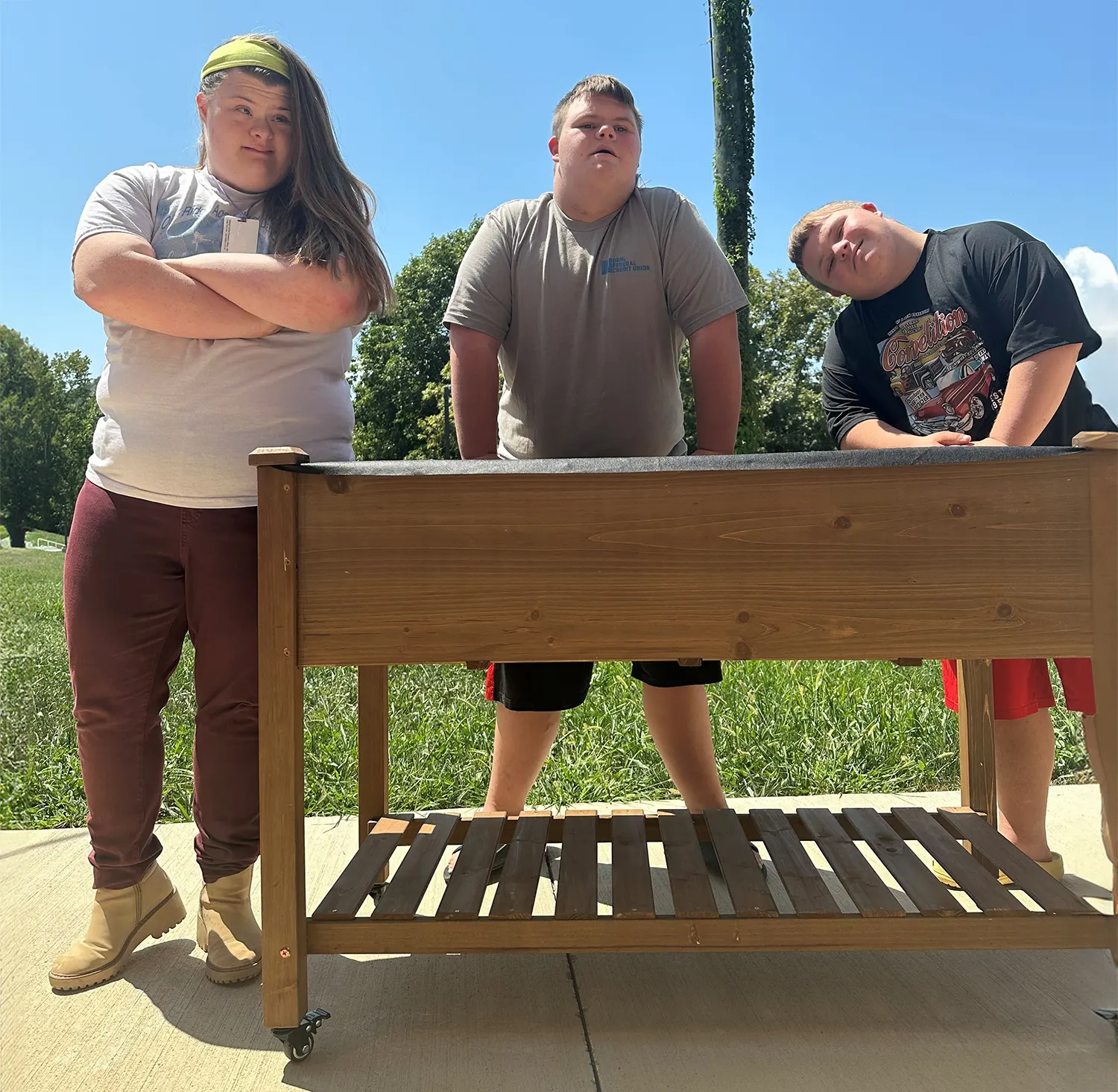 After assembling the new equipment, Special Education students at Oliver Springs High School are excited to learn about composting.