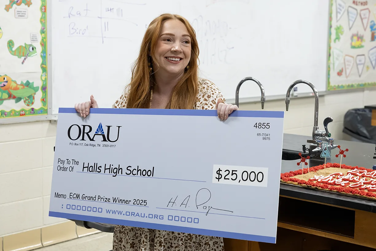 Halls High School teacher Abby Rase celebrates winning the ORAU 2025 Extreme Classroom Makeover 