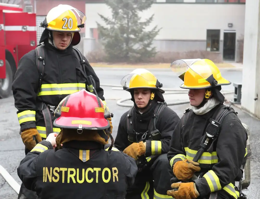 Fire personnel in a training session with an instructor