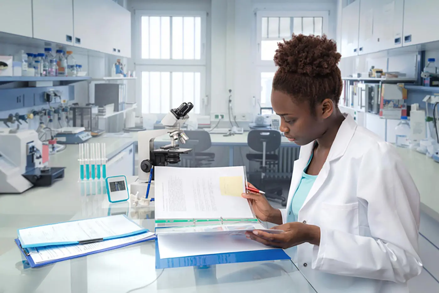 A female student conducts research in a lab setting