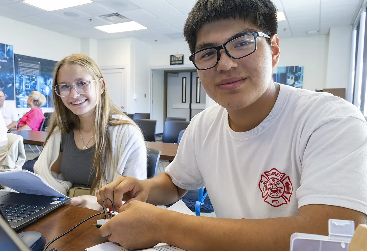 Students build robotics during a STEM workshop